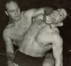 Jimmy Niblett - the man of granite - in head lock
